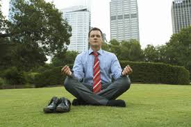 Man meditating outside - tie